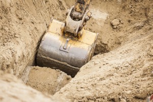 Working Excavator Tractor Digging A Trench.